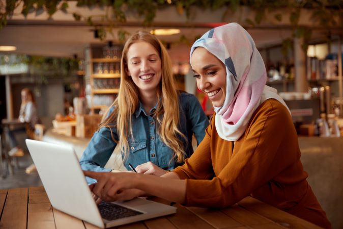 barbri-image-two-students-looking-at-laptop-smiling.png