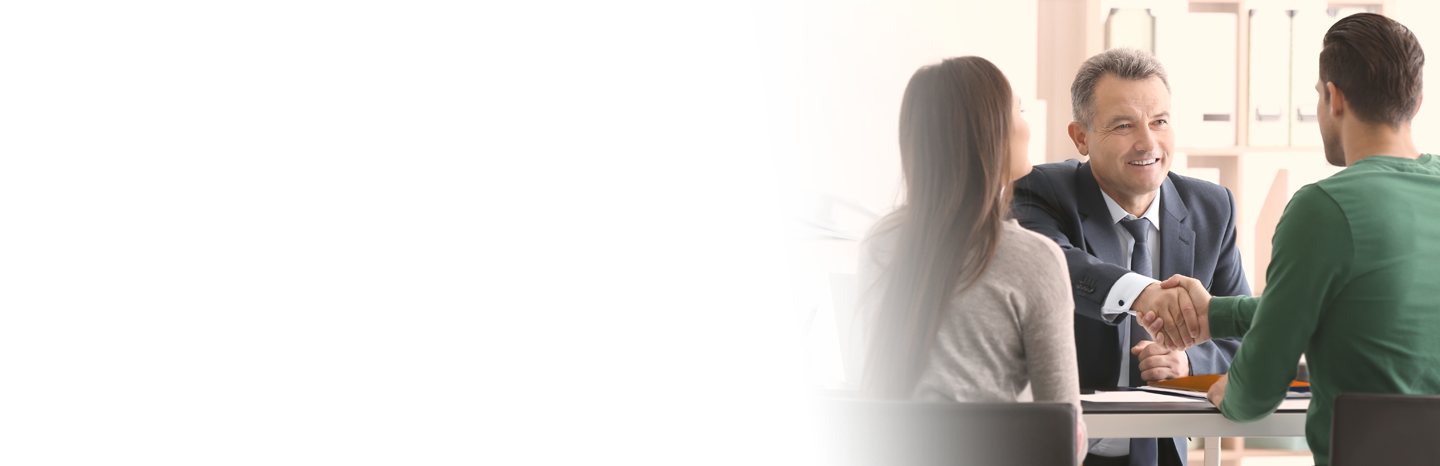 Lawyer shaking hands with client in the office