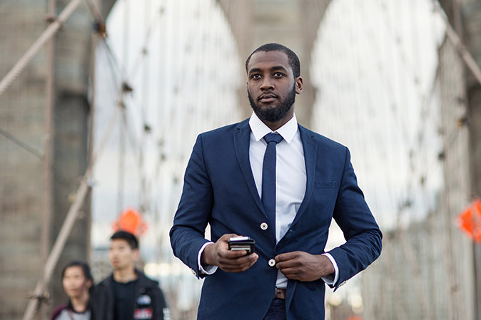 Young man walking on a bridge in New York