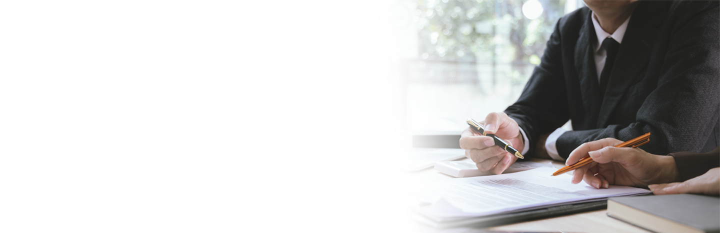 Two lawyers working on a contract in the office